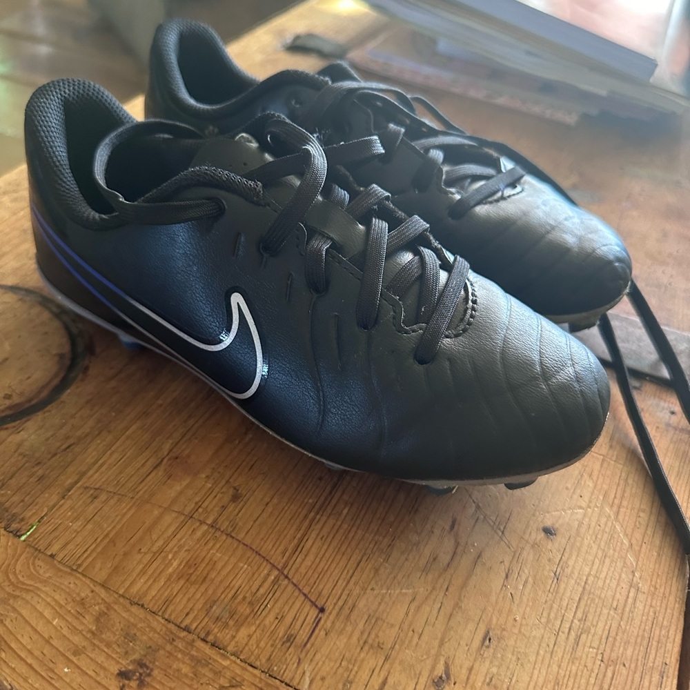 Nike Black Soccer Cleats with Blue Accent